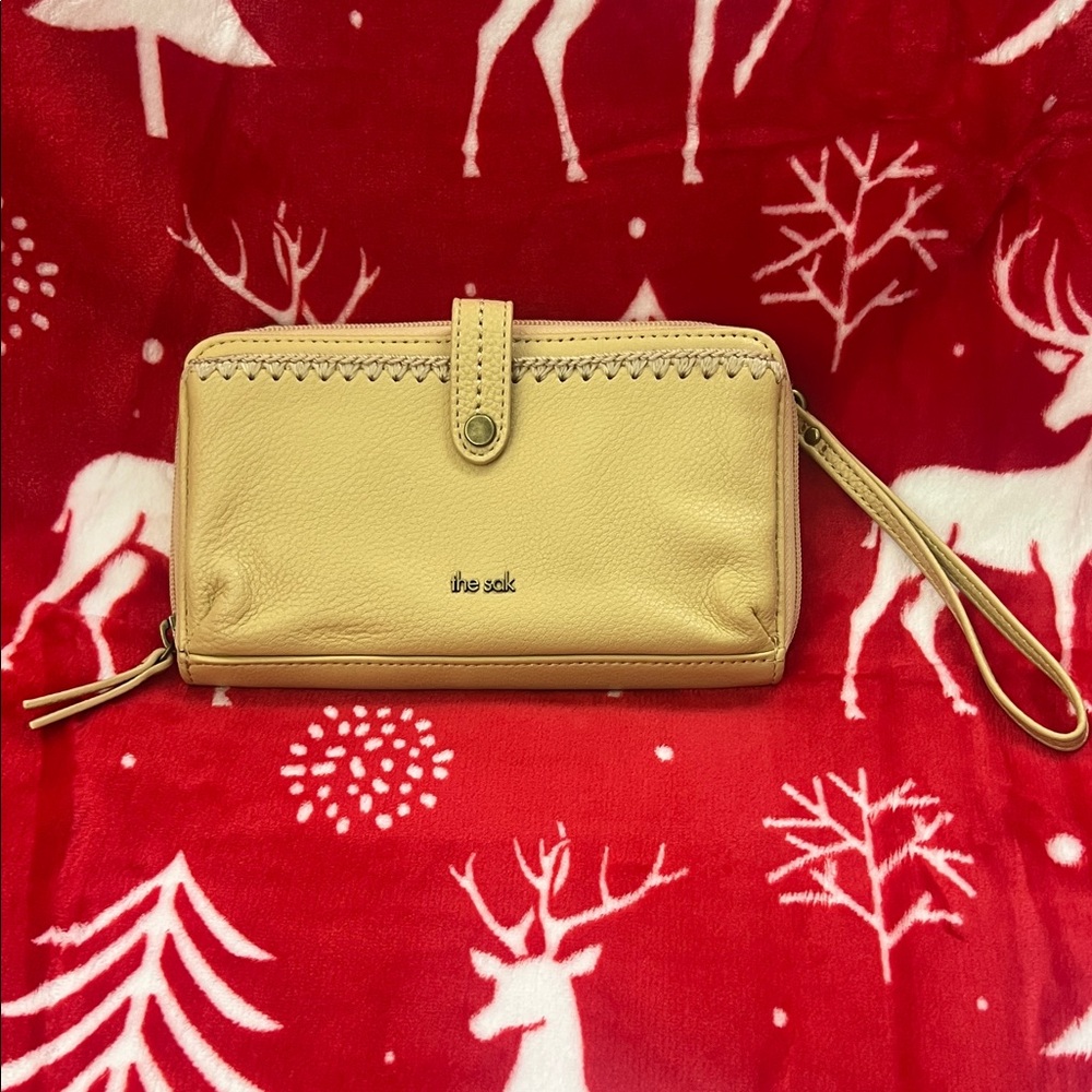 Like New the Sak leather wristlet mustard color